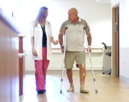 PT and patient walking