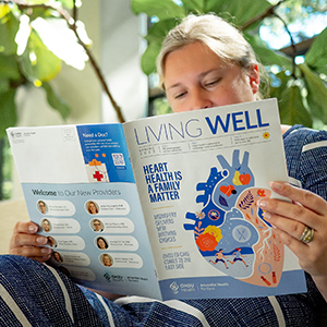 Living Well Publications: Woman reads Living Well magazine in a bright sunny room