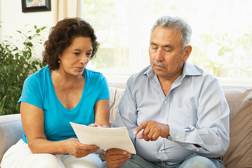 Man and Woman reviewing health care options